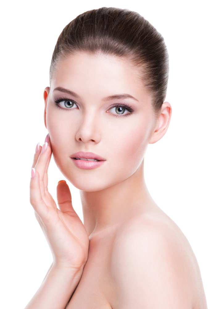beautiful-young-woman-with-fresh-clean-skin-that-touches-her-face-with-hand-isolated-white (1)